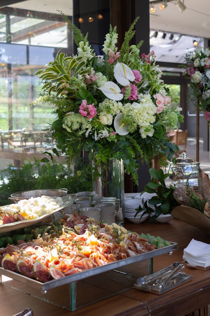 Home Beautiful floral arrangements and appetizers at an elegant buffet in São Paulo, Brazil.